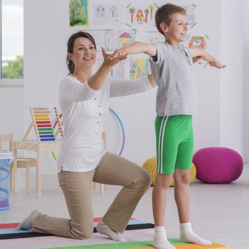 physiotherapist exercising with a school boy 2021 08 26 15 43 21 utc 1